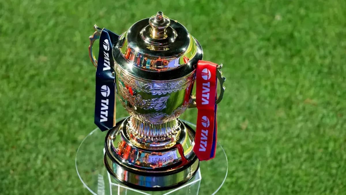 Trophy displayed on a glass stand on grass Trophy displayed on a glass stand on grass