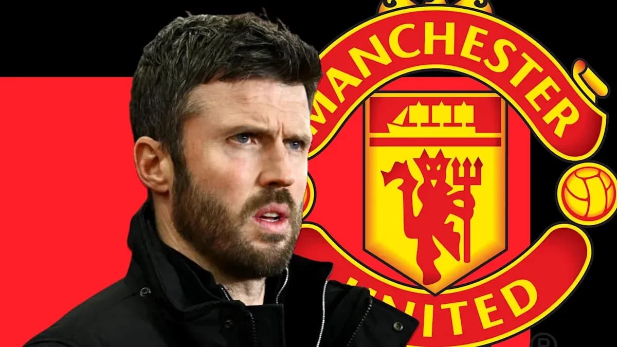 Man in front of Manchester United logo Man in front of Manchester United logo