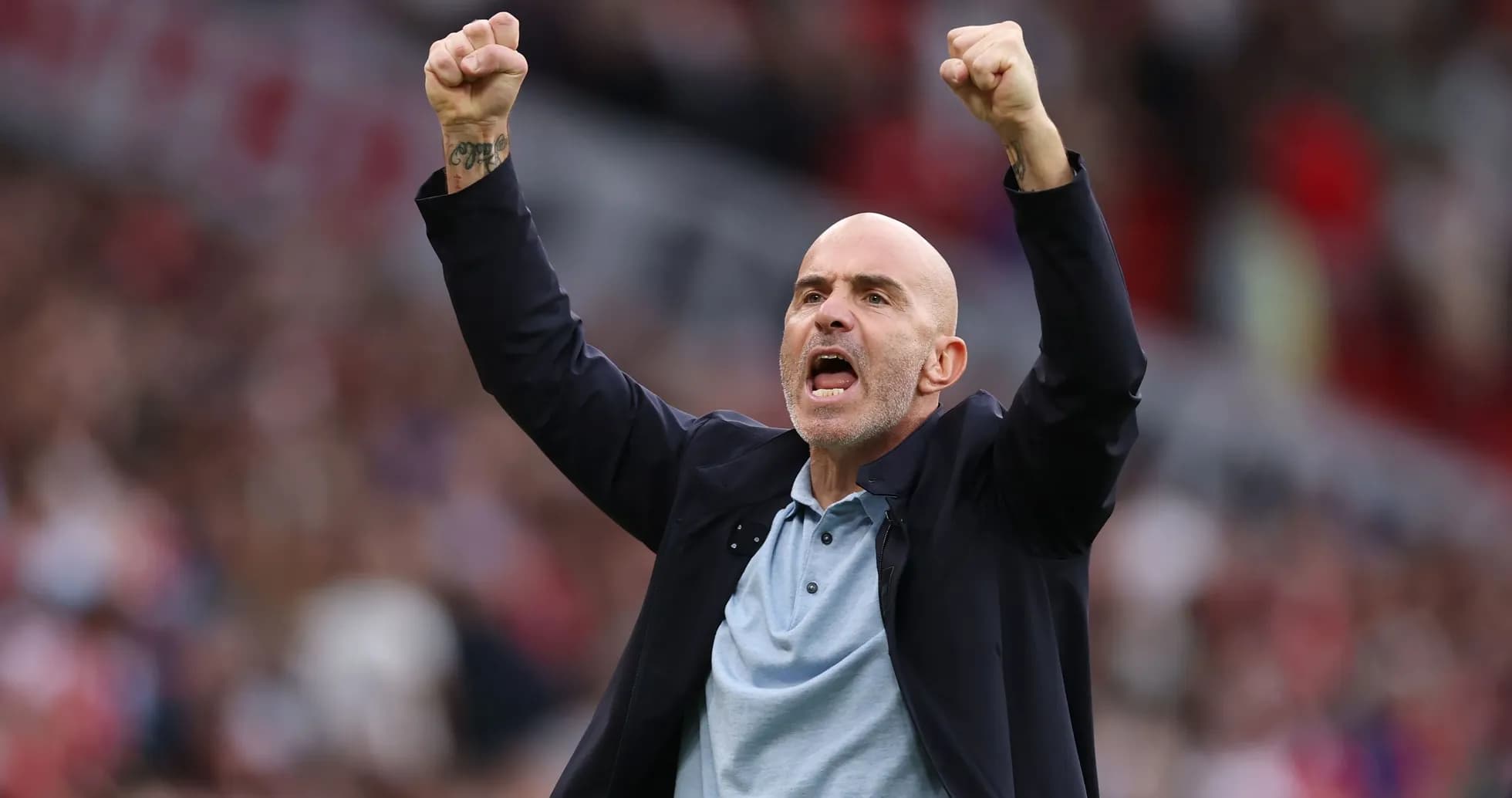 Coach celebrating passionately during a match Coach celebrating passionately during a match