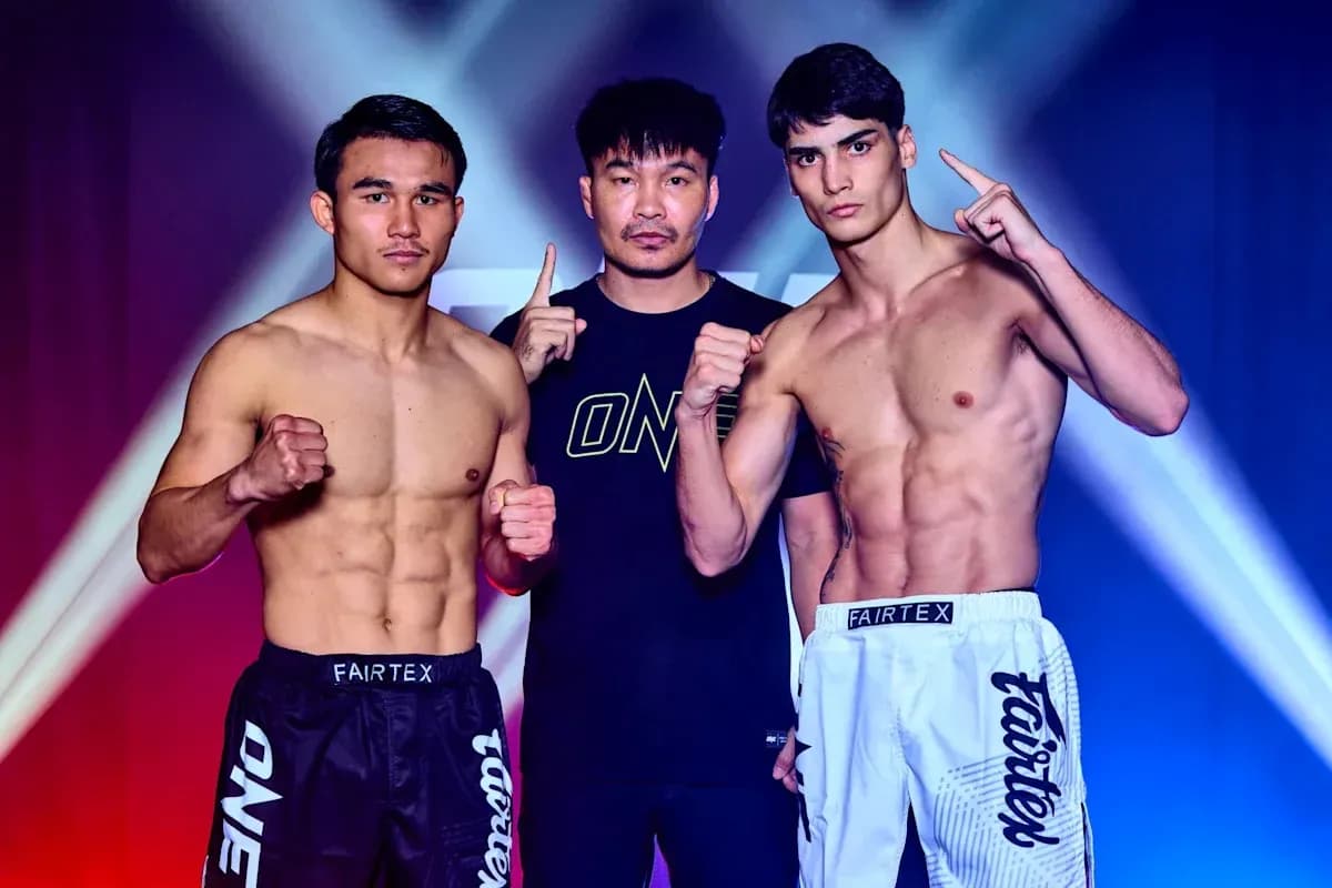 Two fighters posing with trainer before match Two fighters posing with trainer before match