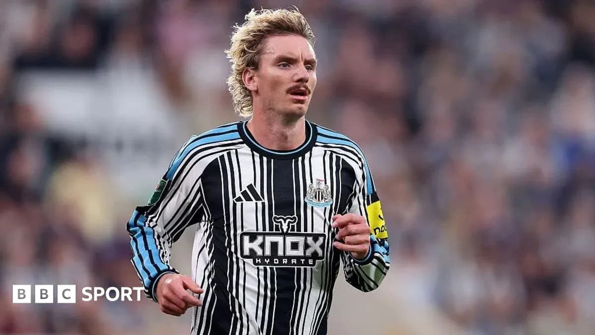 Player running in Newcastle United home kit Player running in Newcastle United home kit