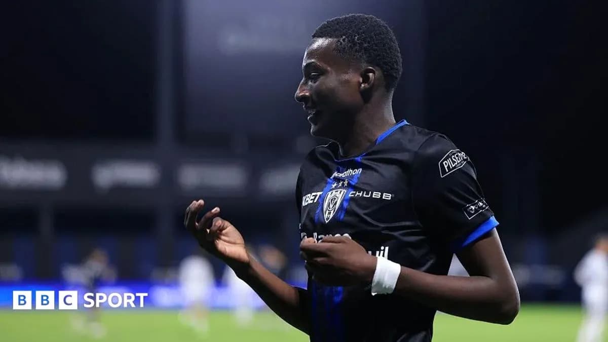 Player celebrating on the pitch during a match Player celebrating on the pitch during a match