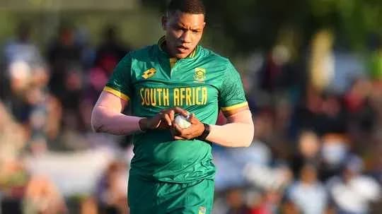 Rugby player in South Africa kit holding ball Rugby player in South Africa kit holding ball