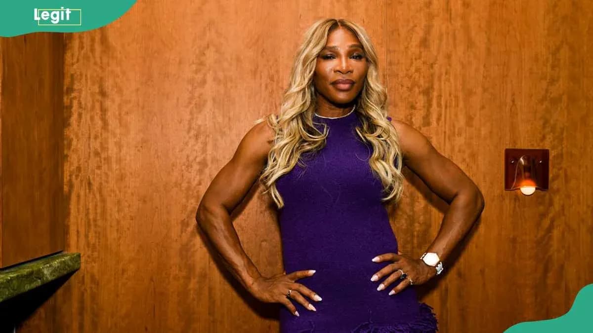 Athlete posing confidently in purple dress Athlete posing confidently in purple dress