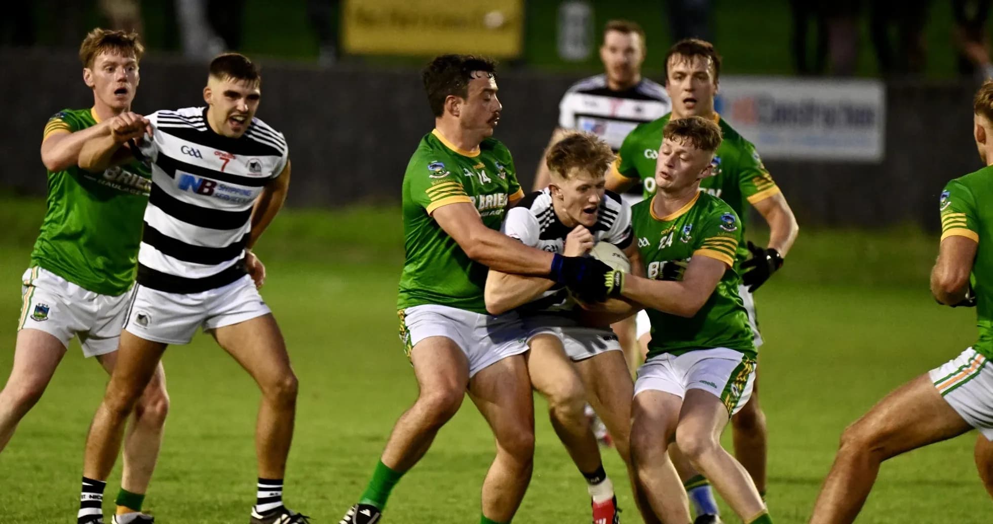 Players from both teams contesting for the ball Players from both teams contesting for the ball