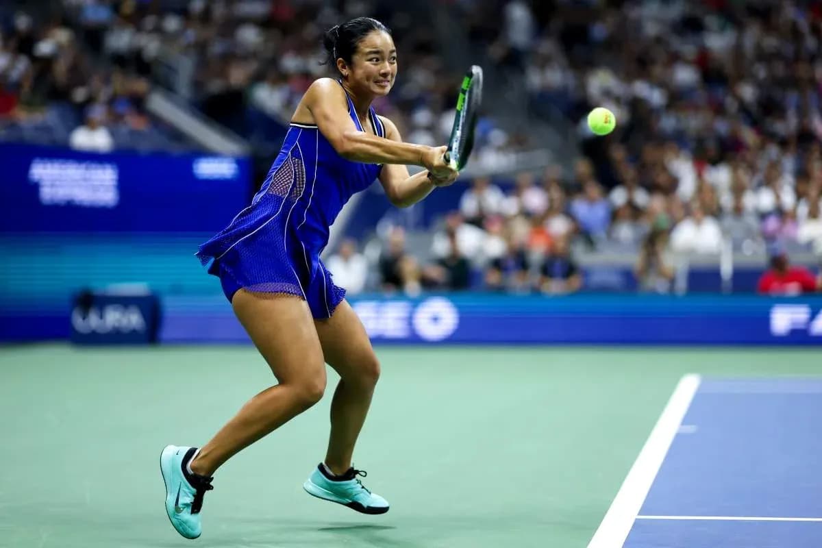 Player hitting a forehand during a tennis match Player hitting a forehand during a tennis match