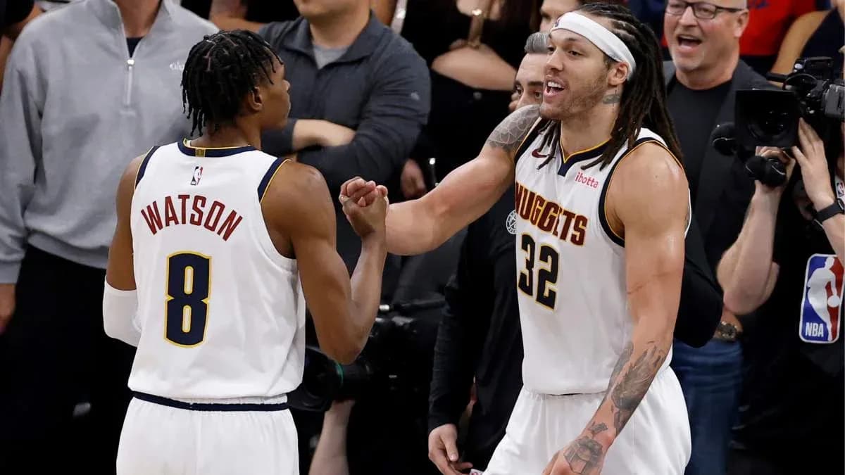 Two players celebrating during a basketball game Two players celebrating during a basketball game