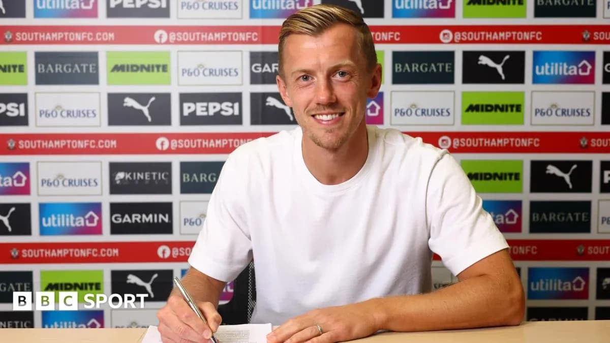 Player signing contract at press conference table Player signing contract at press conference table