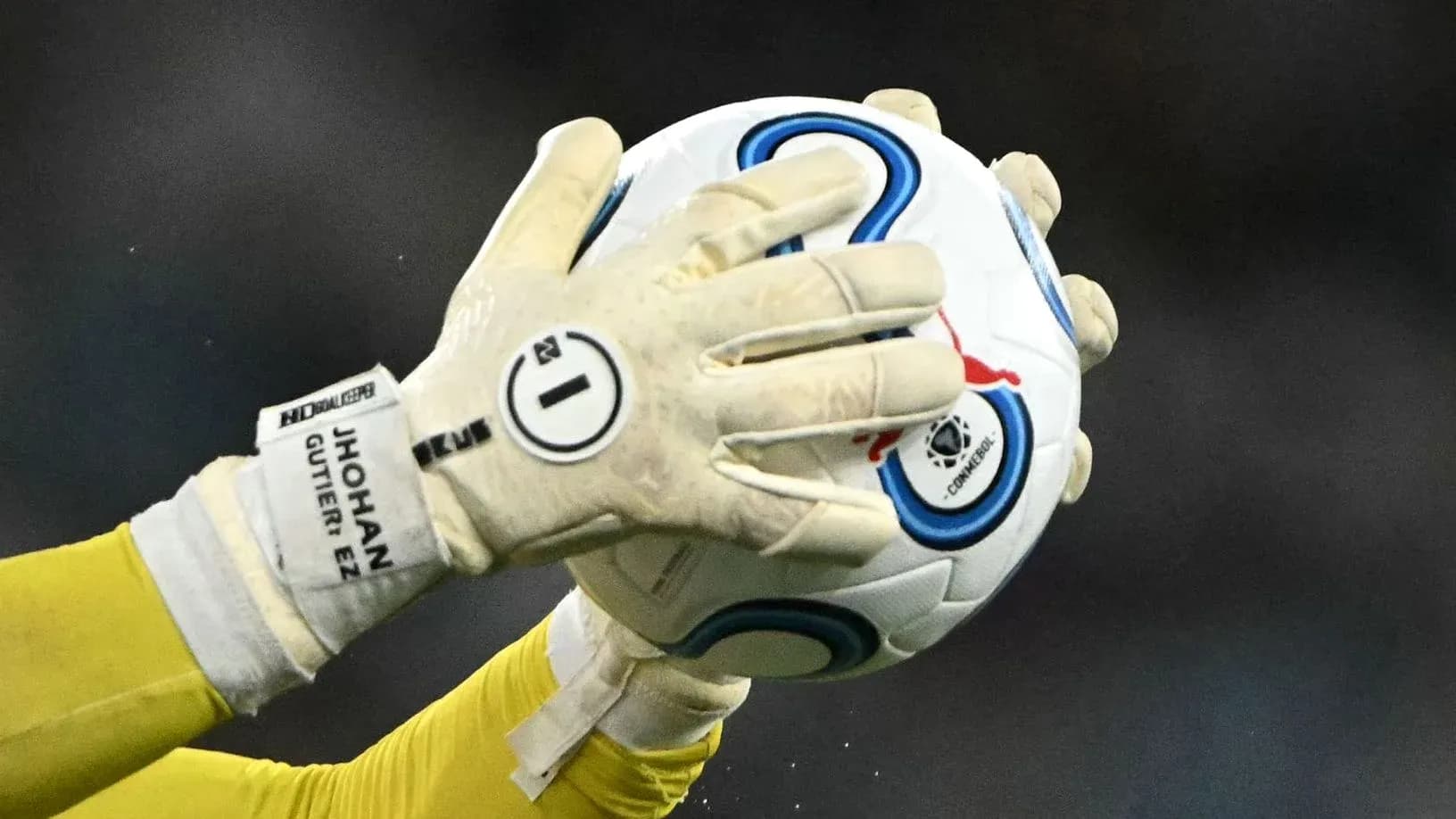 Goalkeeper catching a soccer ball during play Goalkeeper catching a soccer ball during play