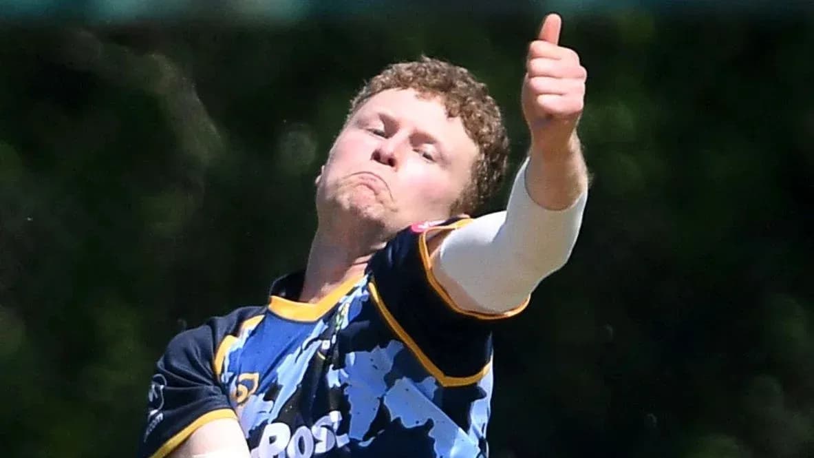 Bowler delivering a ball with a thumbs up gesture Bowler delivering a ball with a thumbs up gesture