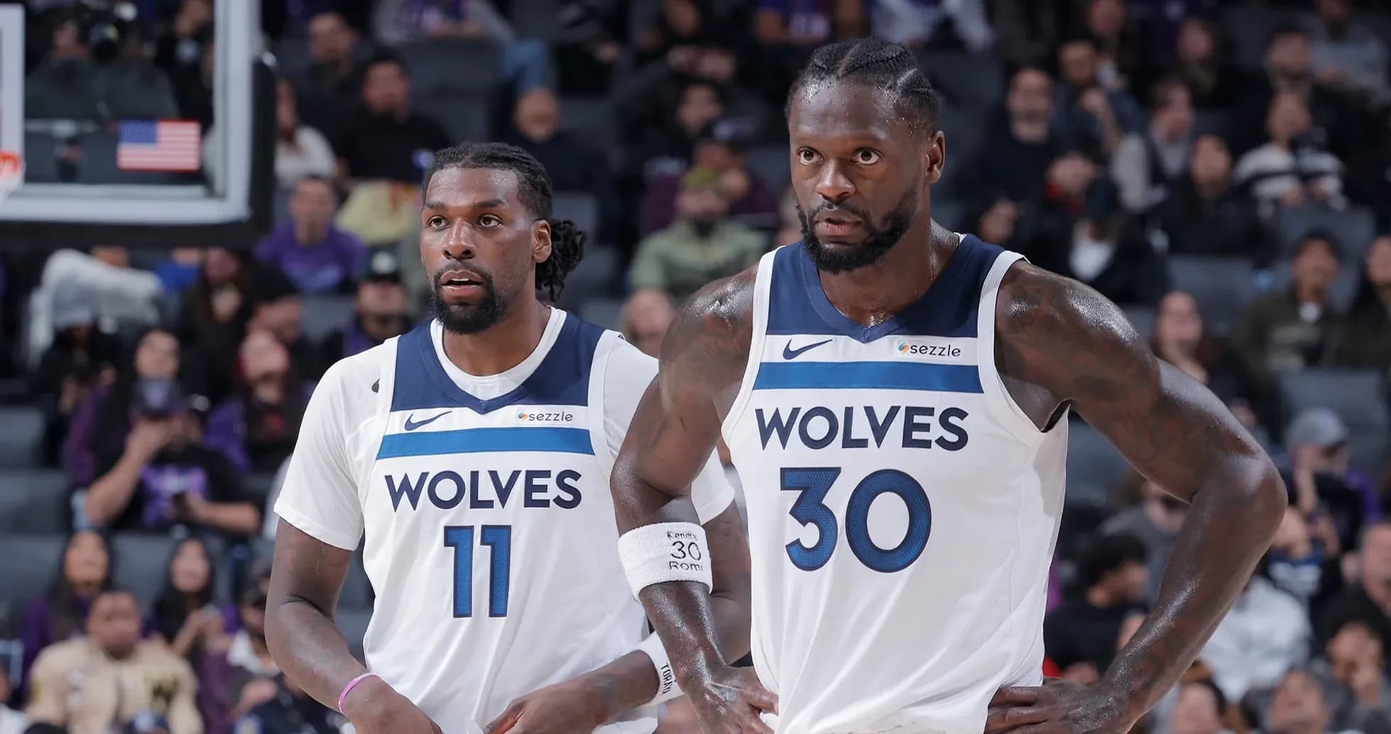 Two Minnesota Timberwolves players on the court Two Minnesota Timberwolves players on the court