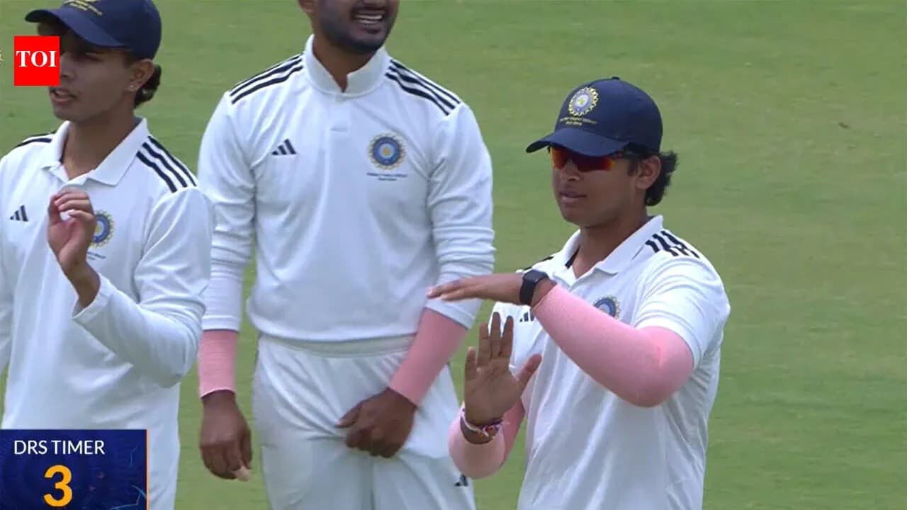 Cricket players discussing strategy on the field Cricket players discussing strategy on the field
