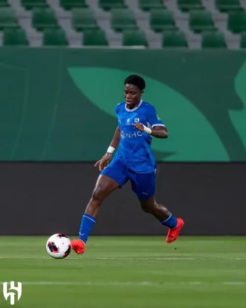 Player dribbling the ball during a soccer match Player dribbling the ball during a soccer match