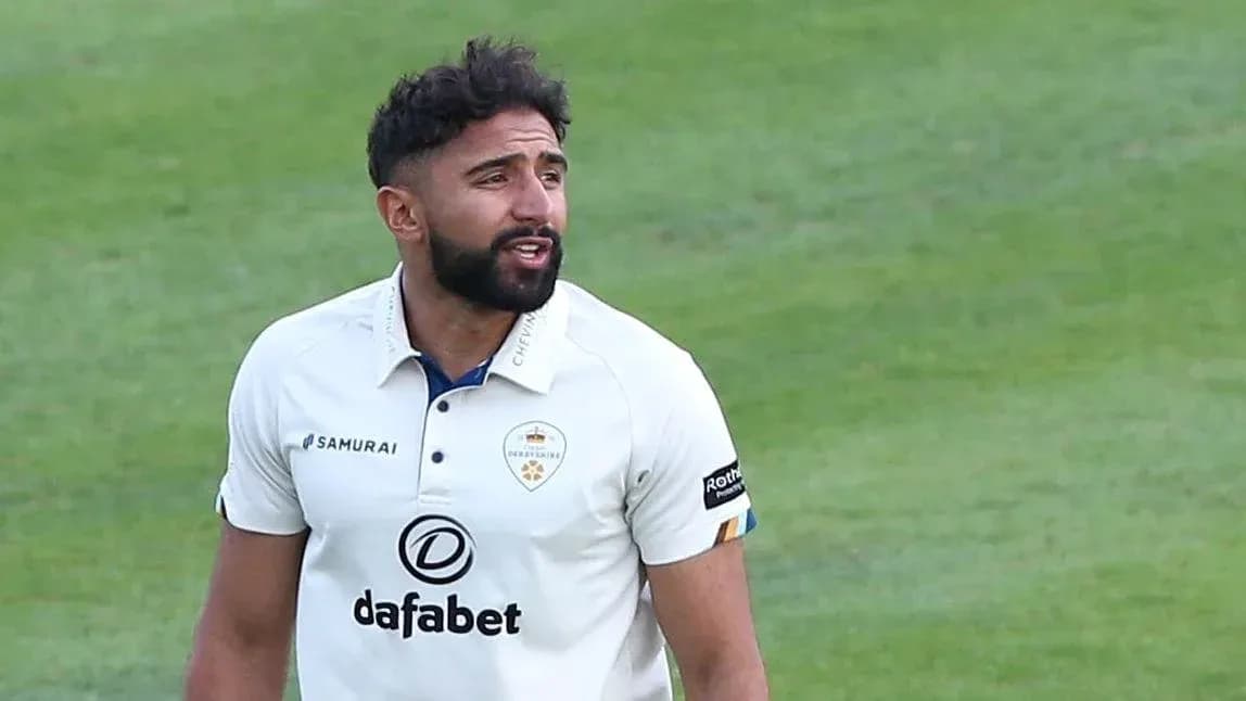 Cricketer in white kit on the field Cricketer in white kit on the field