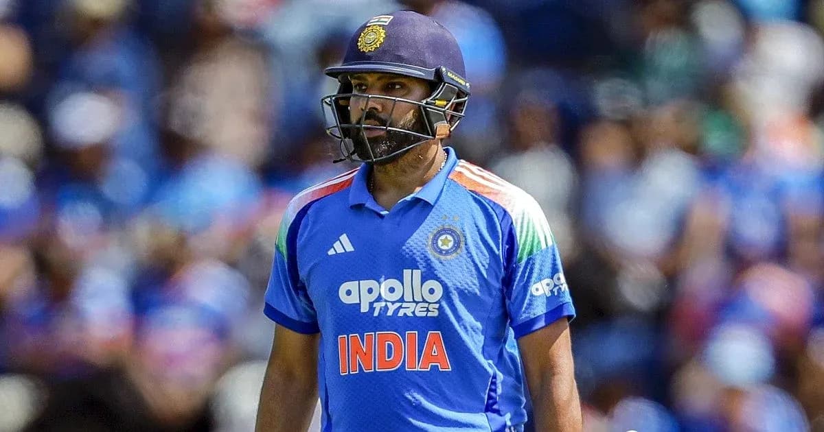 Indian cricketer in blue jersey walking on field Indian cricketer in blue jersey walking on field