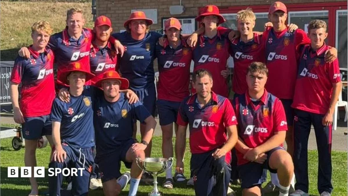 Cricket team celebrating with trophy after victory Cricket team celebrating with trophy after victory
