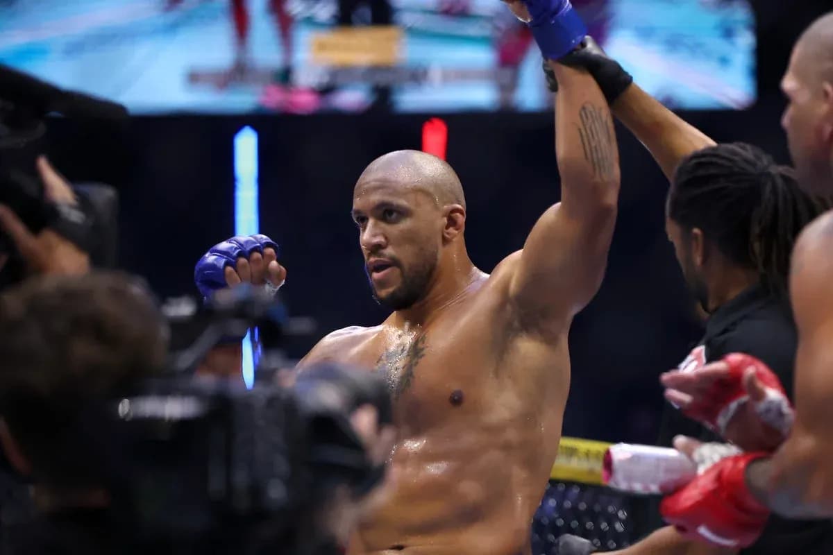 Fighter celebrating victory in the octagon Fighter celebrating victory in the octagon