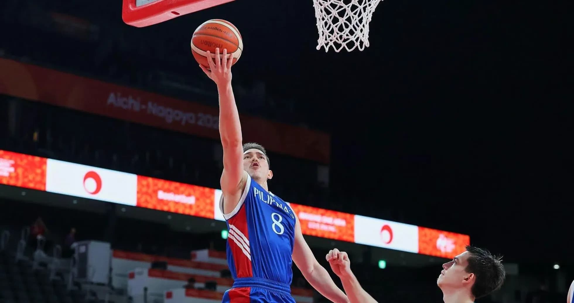 Player scoring a layup during basketball match Player scoring a layup during basketball match