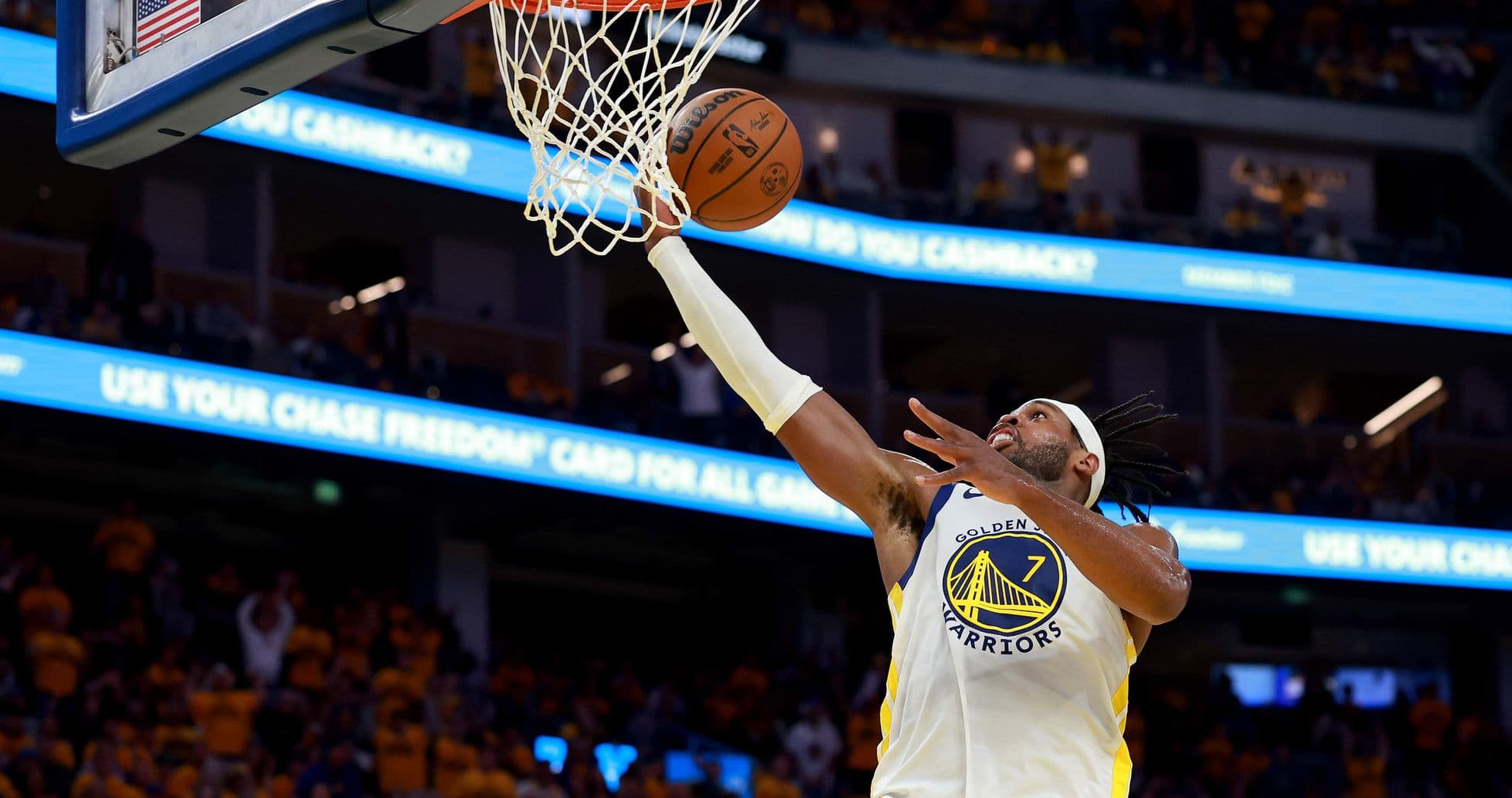 Player making a layup during basketball game Player making a layup during basketball game