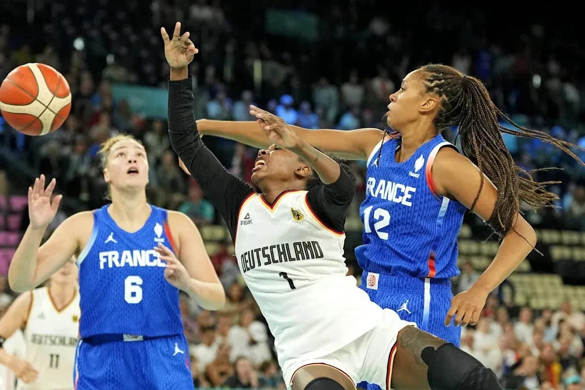 Germany and France players competing for the basketball Germany and France players competing for the basketball