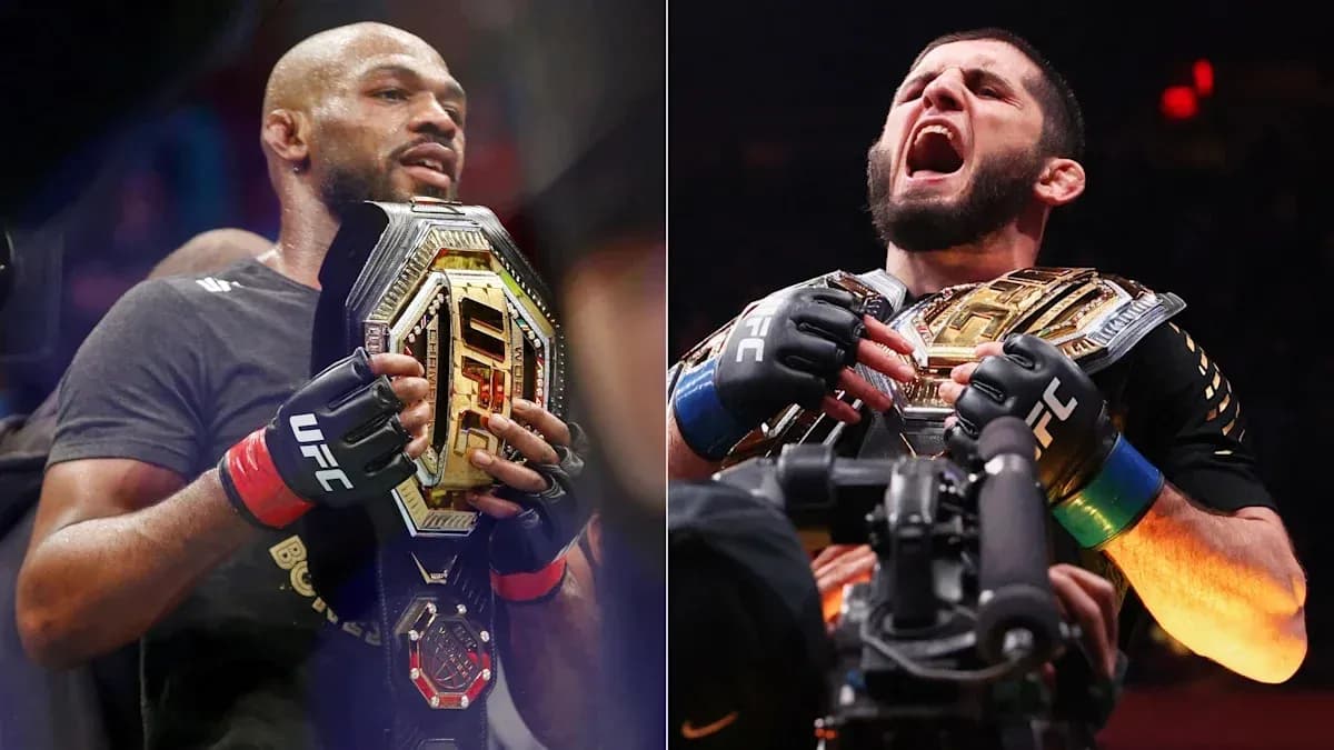 Two UFC champions holding their belts in celebration Two UFC champions holding their belts in celebration