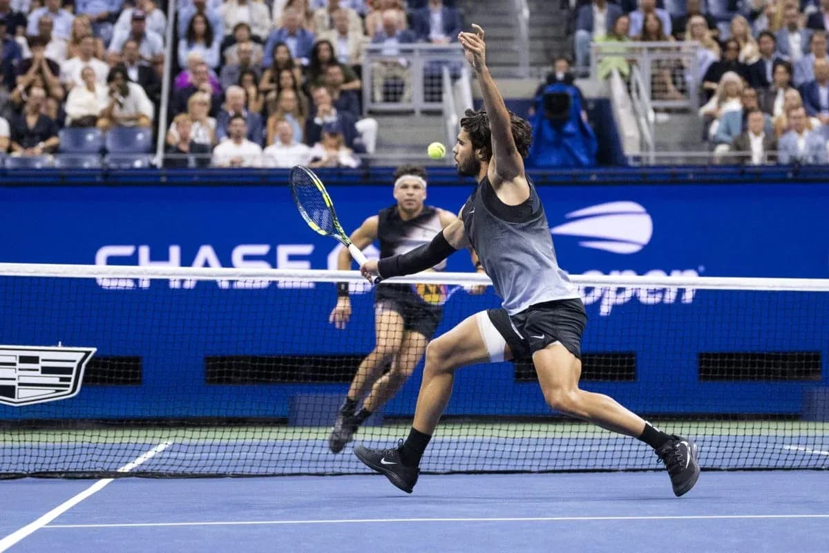 Player hitting a tennis ball during match at US Open Player hitting a tennis ball during match at US Open