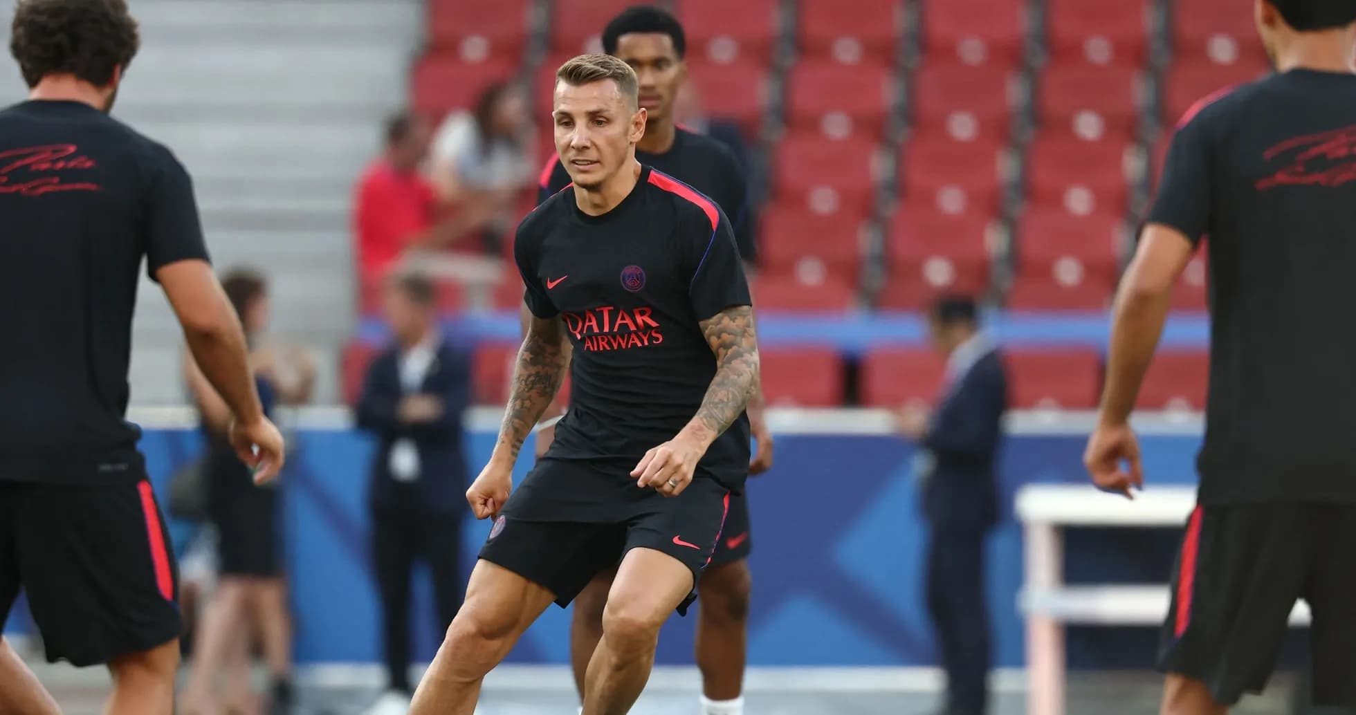 Player training on pitch during team practice session Player training on pitch during team practice session