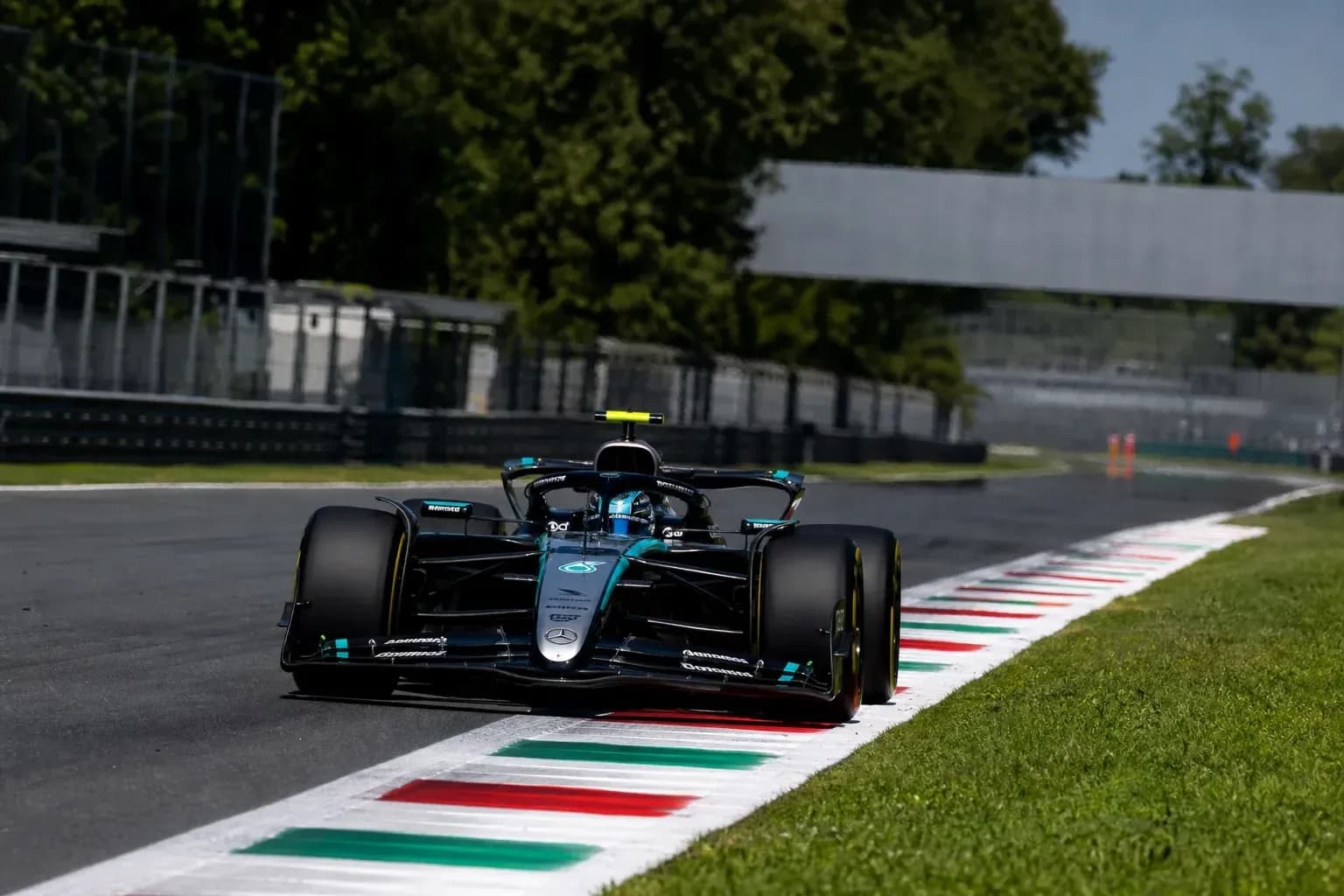 Formula 1 car navigating track at Monza Formula 1 car navigating track at Monza