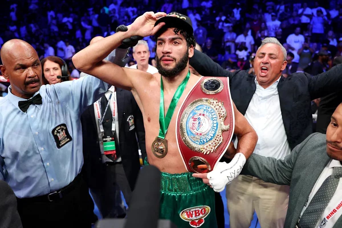 Boxer celebrating victory with championship belt Boxer celebrating victory with championship belt