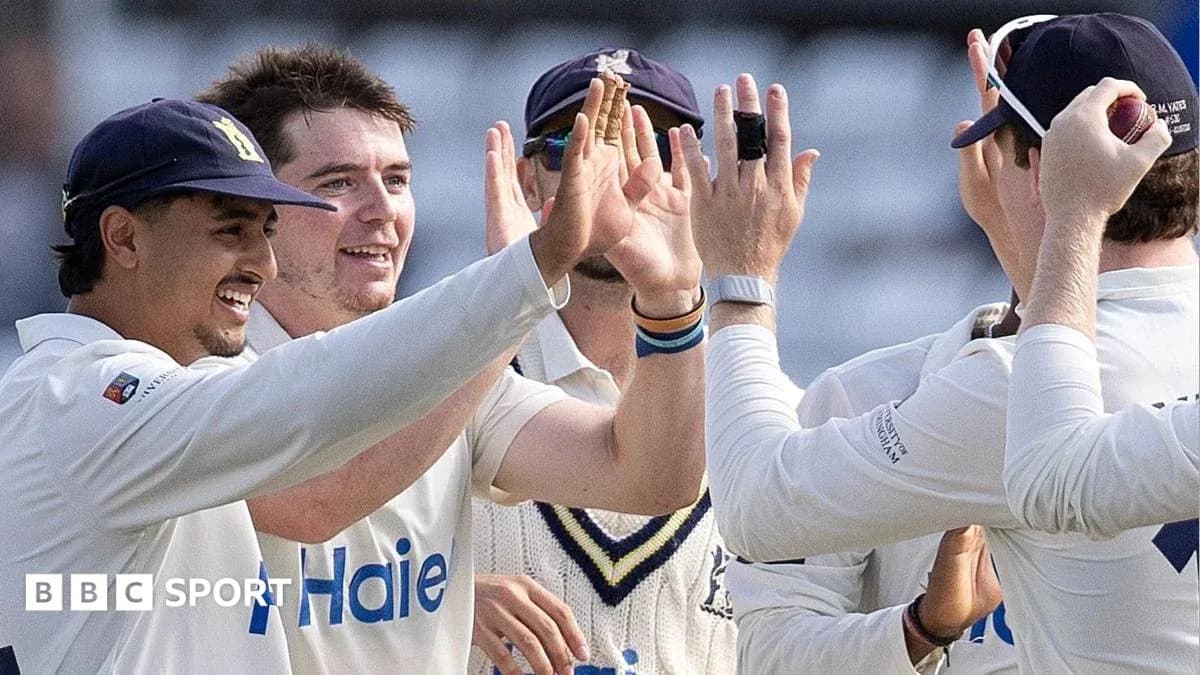 Cricket players celebrating a wicket together Cricket players celebrating a wicket together