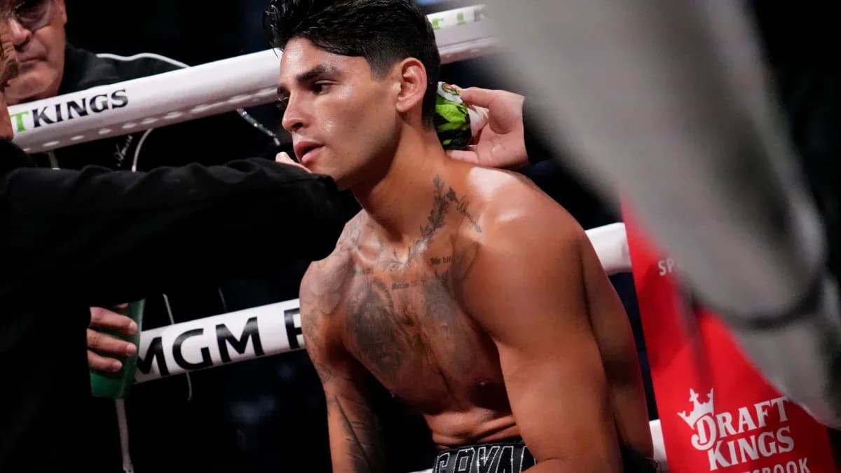 Boxer receiving assistance in corner during match Boxer receiving assistance in corner during match