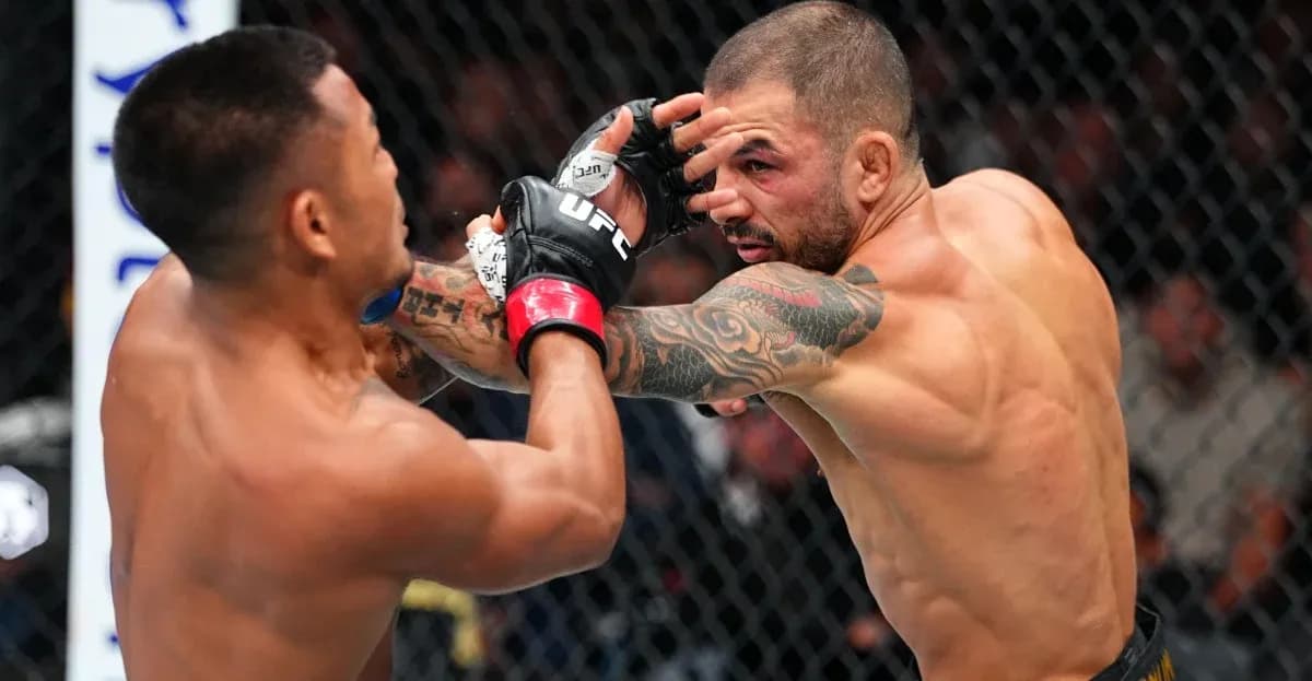 Two fighters exchanging punches inside the octagon Two fighters exchanging punches inside the octagon