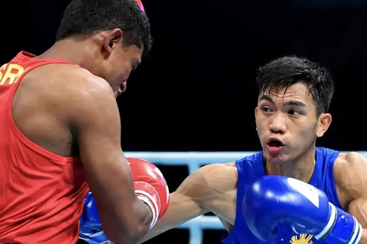 Two boxers exchanging punches in the ring Two boxers exchanging punches in the ring