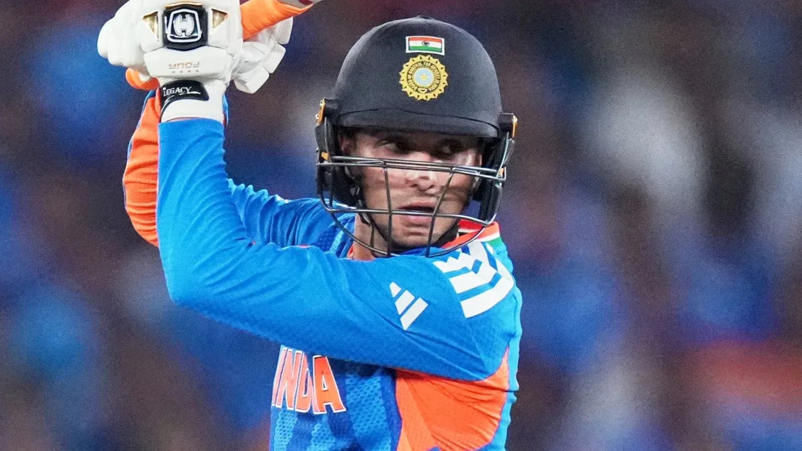 Batsman preparing to strike during cricket match Batsman preparing to strike during cricket match