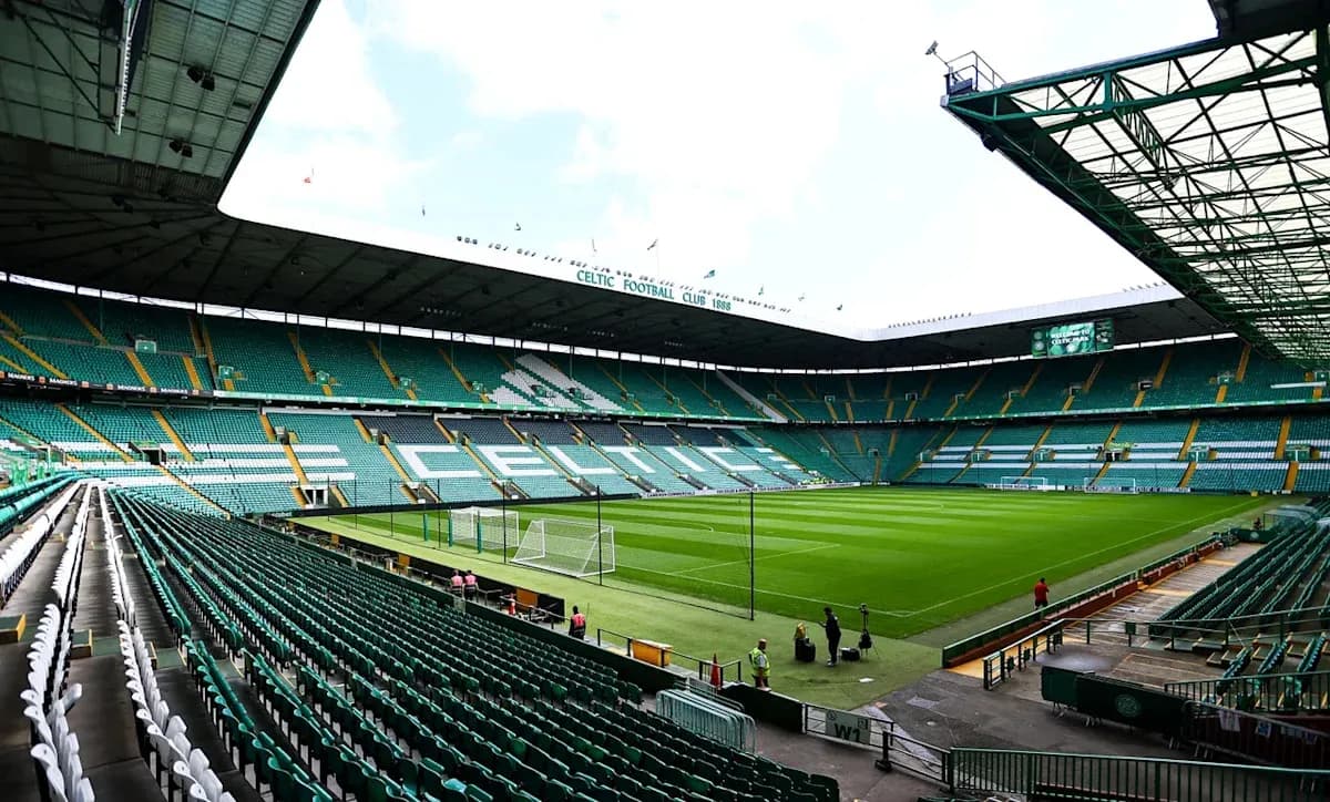Empty Celtic Park stadium with green seating and pitch Empty Celtic Park stadium with green seating and pitch