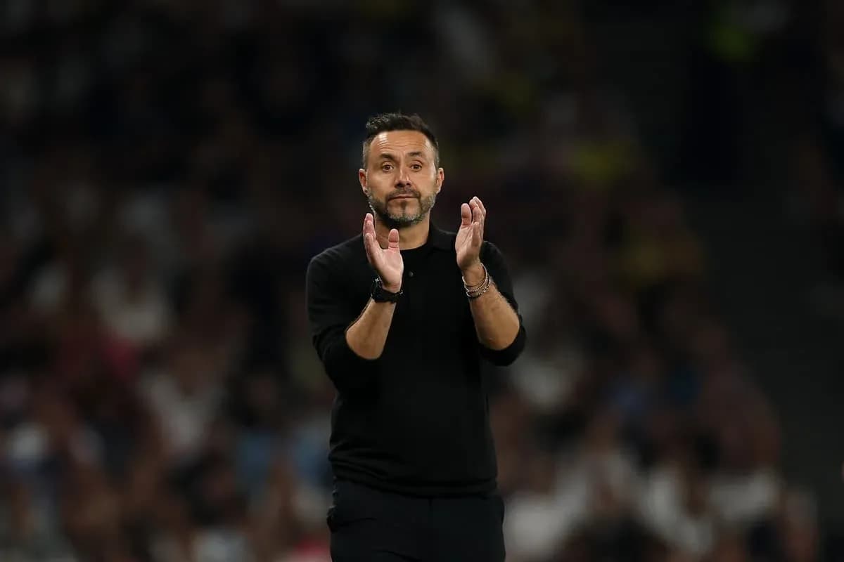 Manager applauding during a match on the sidelines Manager applauding during a match on the sidelines