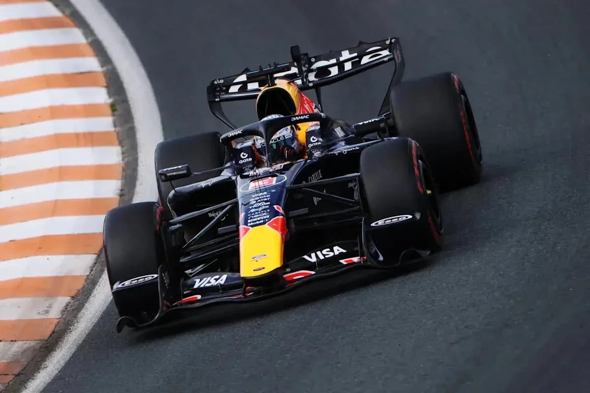 Formula 1 car navigating a racetrack corner Formula 1 car navigating a racetrack corner