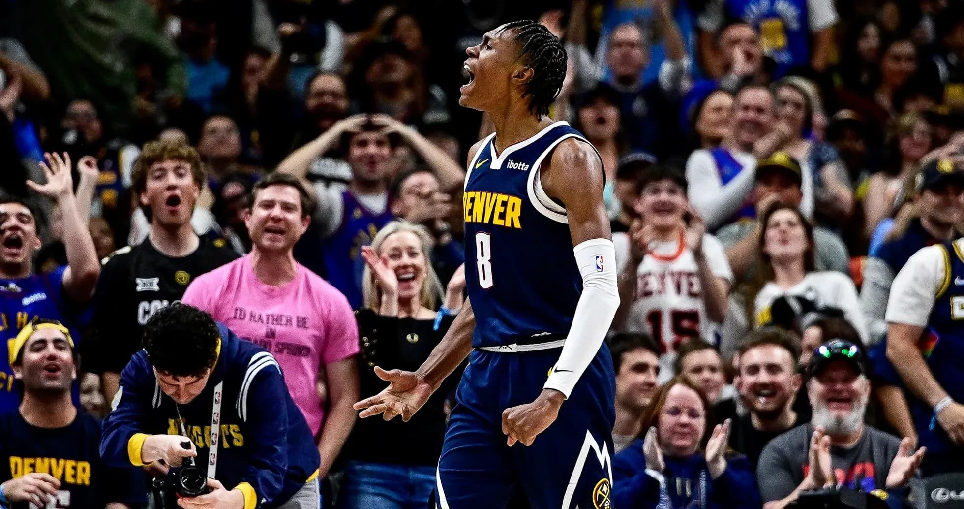 Player celebrating with fans during Denver game Player celebrating with fans during Denver game