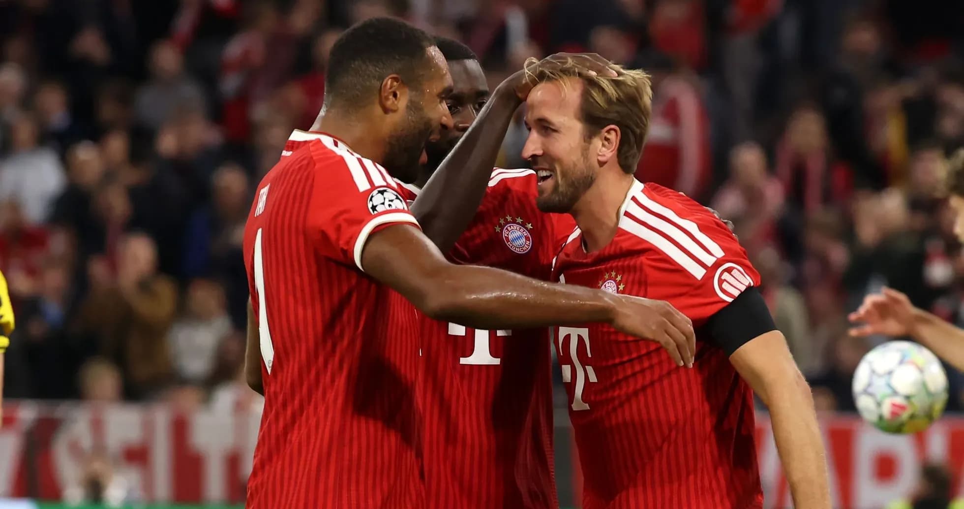 Bayern Munich players celebrating a goal together Bayern Munich players celebrating a goal together