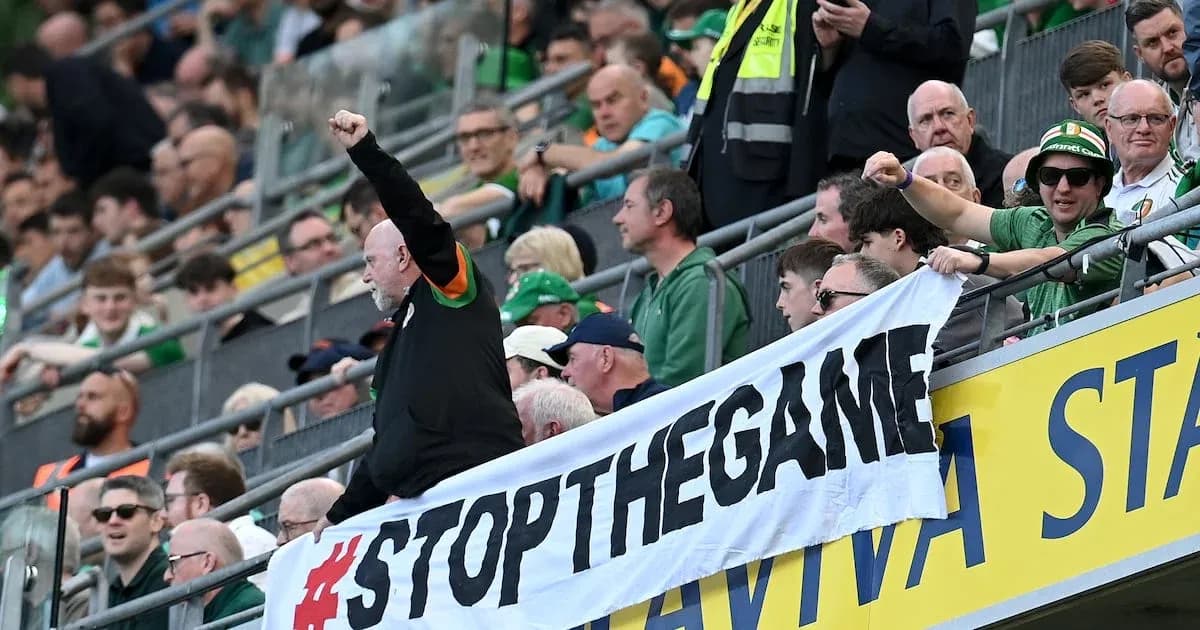 Fans holding a banner during a sporting event Fans holding a banner during a sporting event