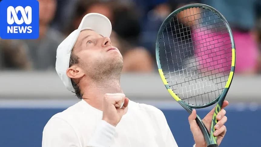 Tennis player celebrating victory with raised racket Tennis player celebrating victory with raised racket