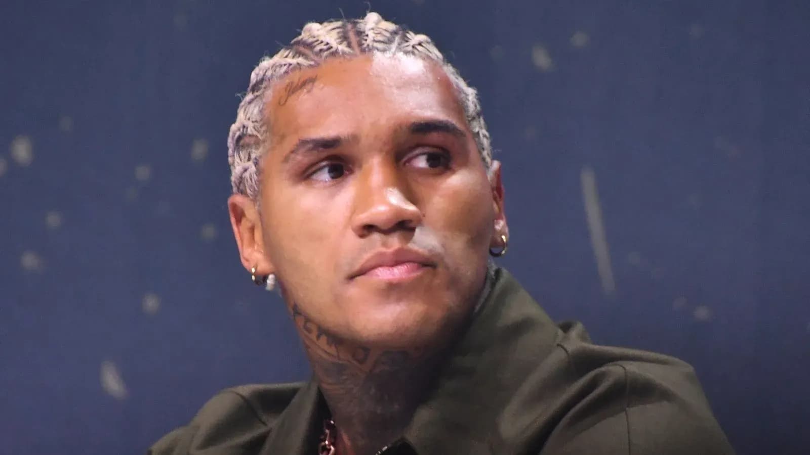 Athlete with braided hair at press conference Athlete with braided hair at press conference