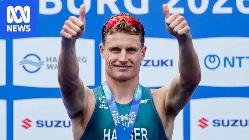 Athlete celebrating with thumbs up and medal Athlete celebrating with thumbs up and medal