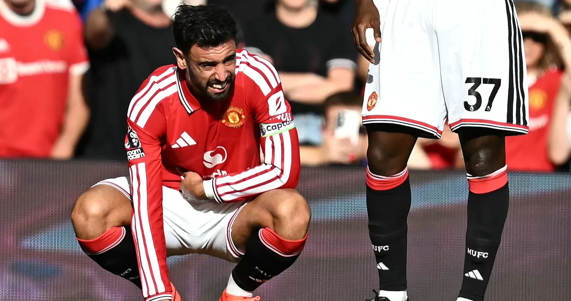 Bruno Fernandes crouching during Manchester United match Bruno Fernandes crouching during Manchester United match