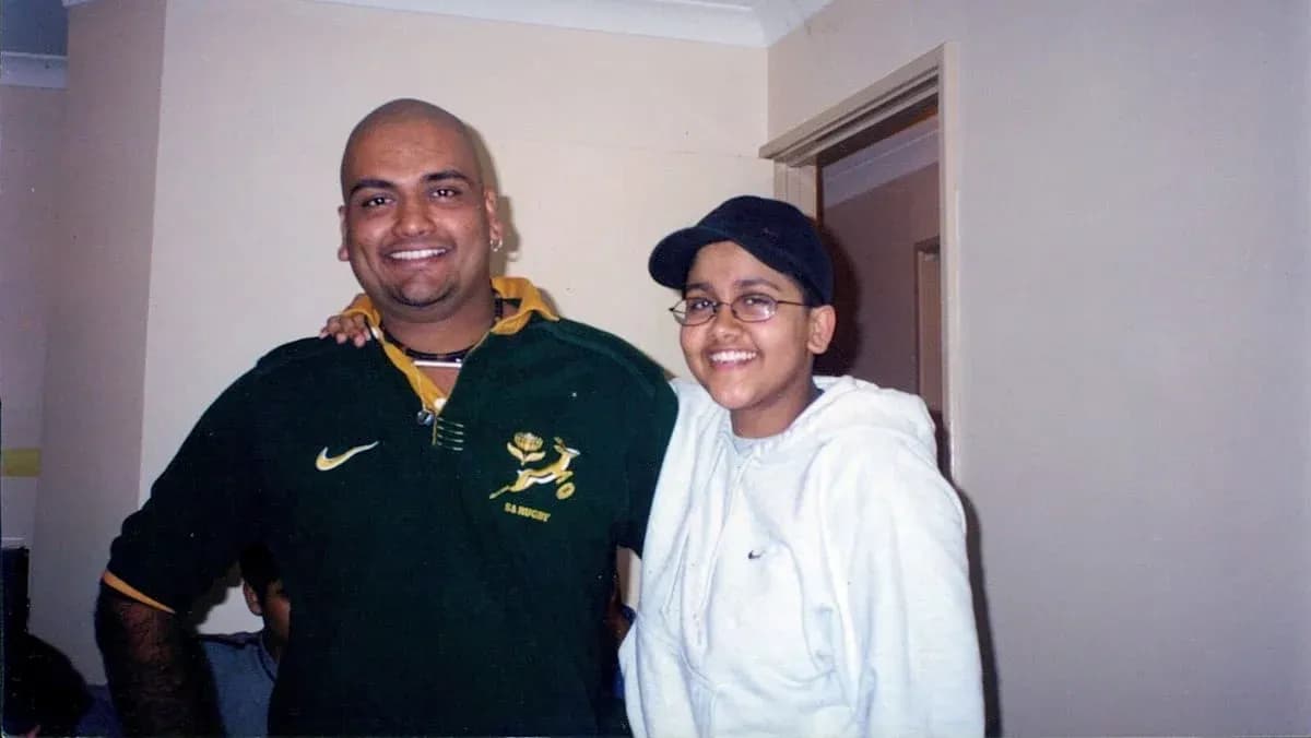 Two individuals posing together in casual clothing Two individuals posing together in casual clothing