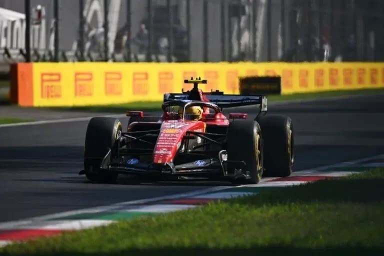 Ferrari car racing on track during Formula 1 event Ferrari car racing on track during Formula 1 event