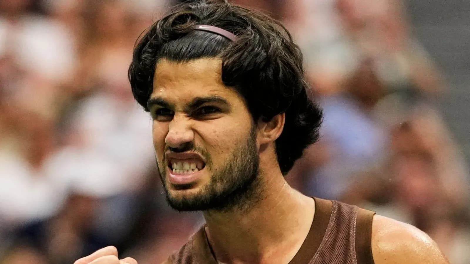Tennis player celebrating with a clenched fist Tennis player celebrating with a clenched fist