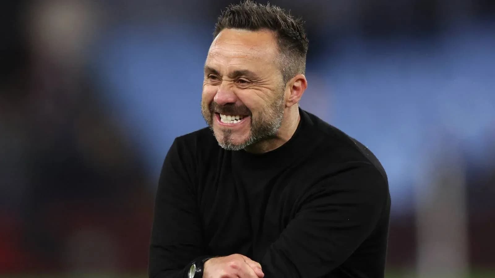 Coach celebrating on the sidelines during match Coach celebrating on the sidelines during match