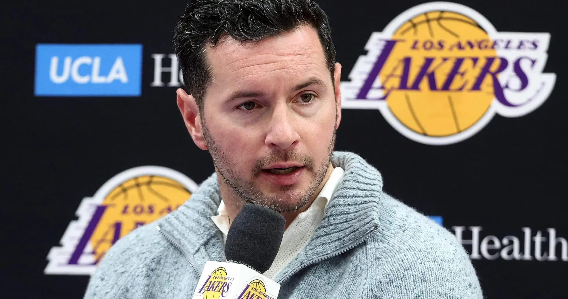 Person speaking at Los Angeles Lakers press conference Person speaking at Los Angeles Lakers press conference