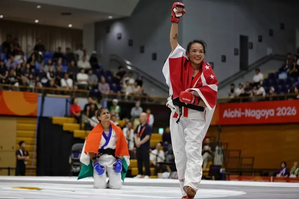 Athlete celebrating victory in martial arts competition Athlete celebrating victory in martial arts competition